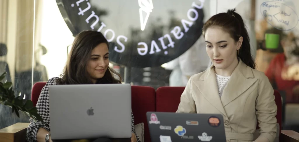 Tiva product team collaborating at their laptops